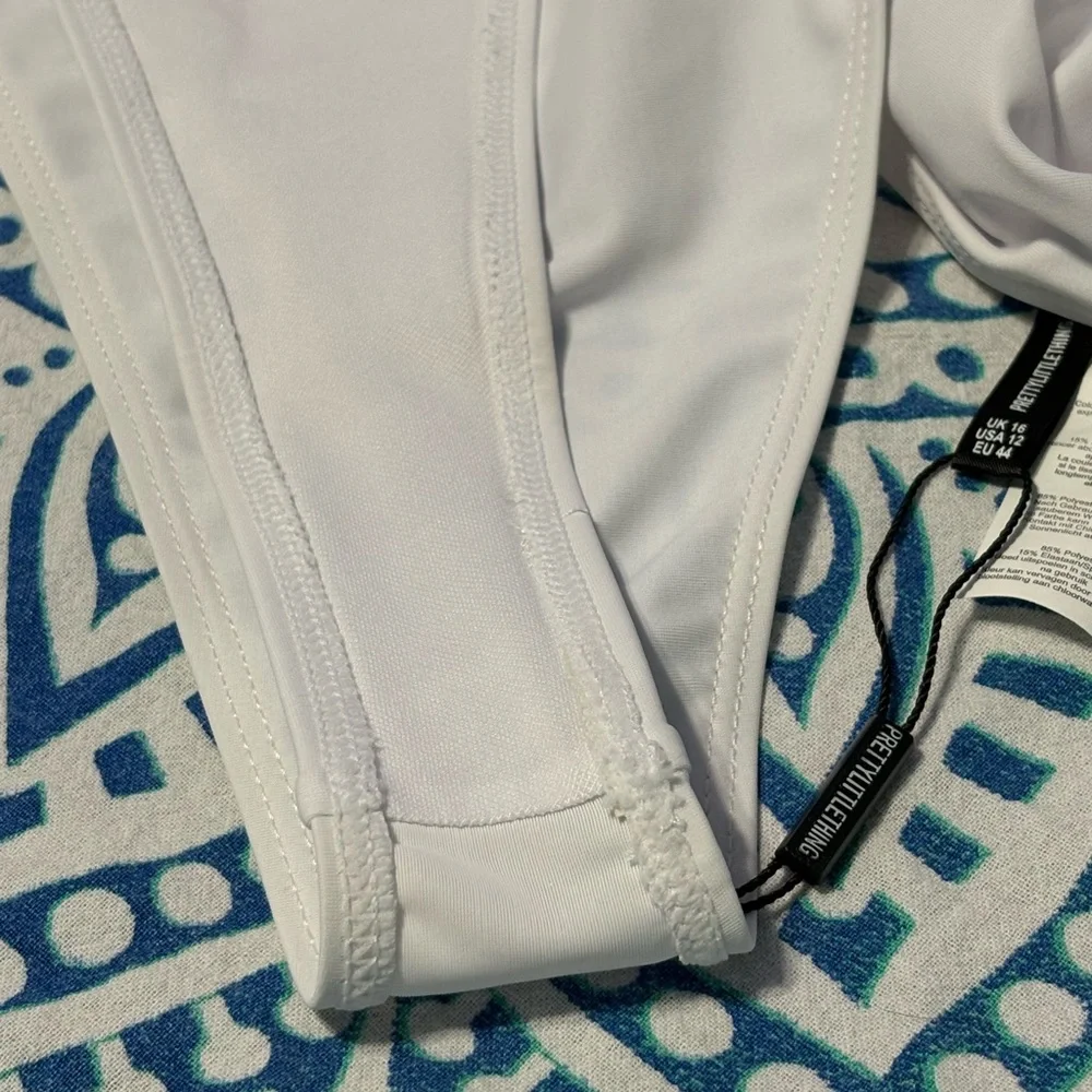 PrettyLittleThing White Asymmetrical Cut-Out One-Piece Swimsuit - Picture 5 of 5